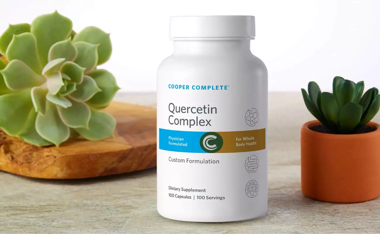 Photo of Cooper Complete Quercetin Supplement bottle and succulents. Photo of Cooper Complete Quercetin Complex Supplement bottle with succulents.